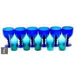 A set of six late 19th Century Bristol Blue wine glasses with an ovoid bowl above a double knopped