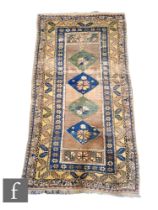 A Turkish Sivas Anatolian Fertek rug, circa 1960, the woven wool rectangular rug with ochre ground