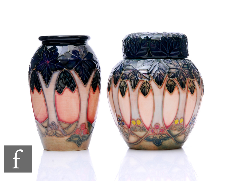 Two Moorcroft pottery Cluny pattern items, to include a ginger jar and vase, heights 11cm. (2)