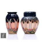 Two Moorcroft pottery Cluny pattern items, to include a ginger jar and vase, heights 11cm. (2)