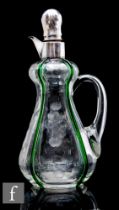 A 20th Century clear crystal glass decanter, of high shouldered and ovoid form, with applied loop