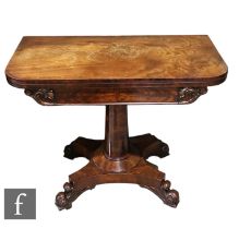 A William IV mahogany fold over tea table with rounded rectangular top above a central pedestal
