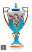 A Minton early 20th Century pedestal vase and cover, the bleu celeste ground picked out with