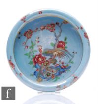 A Carlton Ware lustre bowl of circular form with folded rim, the central field painted with a