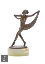 A small Josef Lorenzl Art Deco bronze figure depicting the scarf dancer, signed to the oval base and