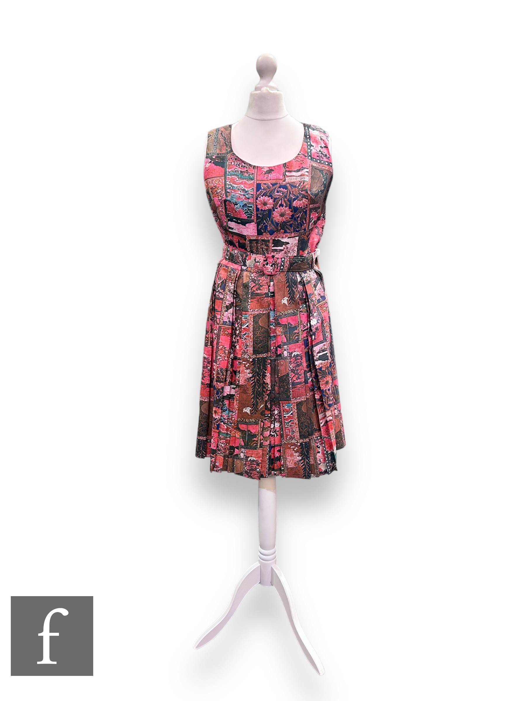 A 1960s vintage sleeveless silk shift dress, with pleated flared skirt and original waist belt,