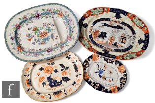 A collection of meat and serving plates, to include two Mason's ironstone examples, all with varying