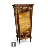 A late 19th and early 20th century Louis XIV style vitrine, gilt metal mounts over concave sides ,