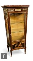 A late 19th and early 20th century Louis XIV style vitrine, gilt metal mounts over concave sides ,