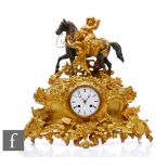 A French 19th Century Japy Freres gilt metal mantle clock, cast with fruiting vines, and