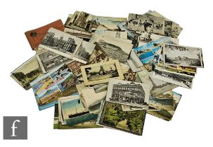 A collection of Edwardian postcards to include real photographic cards, views, street scenes and a