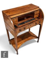 An Edwardian mahogany cylinder bureau de dame, rolling front enclosing fitted interior with pull-out