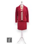 A 1960s vintage red three piece suit, comprising structured jacket with button fastening, pencil