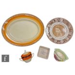 A small collection of Clarice Cliff ceramic items, comprising a Wilkinson square dish decorated with