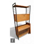 A mid Century Ladderax shelving unit, the black metal frame with fall front cupboard, drawer and