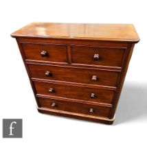 A Victorian mahogany straight front chest of two short and three long drawers, turned wood handles