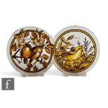 A pair of 19th Century stained glass roundels, each hand enamelled with scenes of wild birds, one to