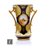 A Coalport 'Jewelled' porcelain vase, circa 1900, of waisted form, flanked by twin solid gilt