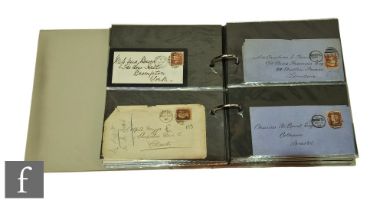 An album of Victoria covers, some with cancellation marks, also penny reds and lilacs. (126)