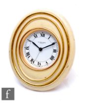 A 1970s brass easel framed bedside clock, reverse marked Cartier Paris 7511 05450.