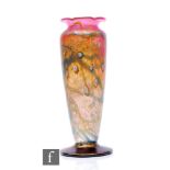 A late 20th Century Okra glass vase, of footed shouldered ovoid form with wavy rim, decorated with