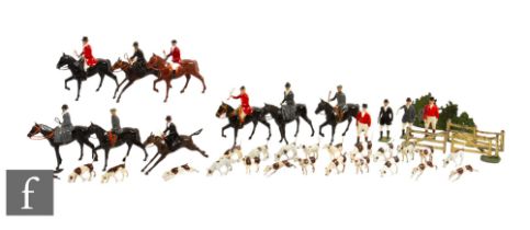 A Britains Hunt set to include nine riders, four huntsman, twenty one hounds and a fox, also two