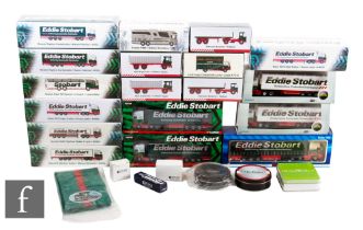 Eighteen Atlas Editions Eddie Stobart diecast models, all boxed, with a selection of notebooks,