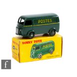 A French Dinky 560 (25BV) Peugeot Postal Van 'Postes', in dark green including ridged hubs, boxed.