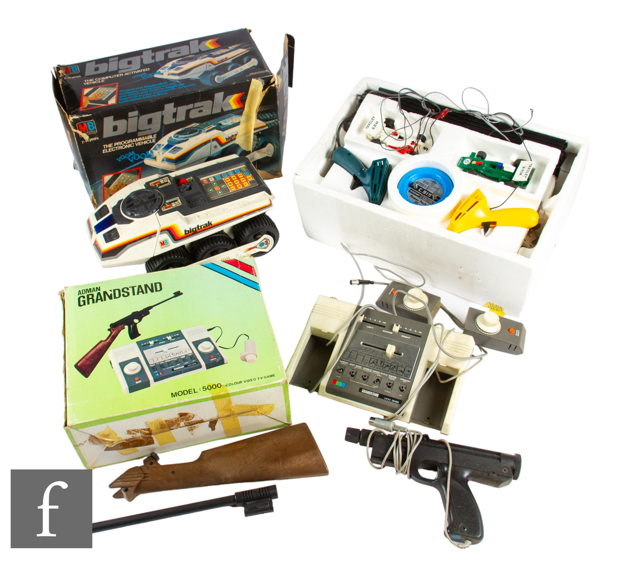 A collection of assorted toys, to include a Scalextric set and accessories, a boxed MG Bigtrak,