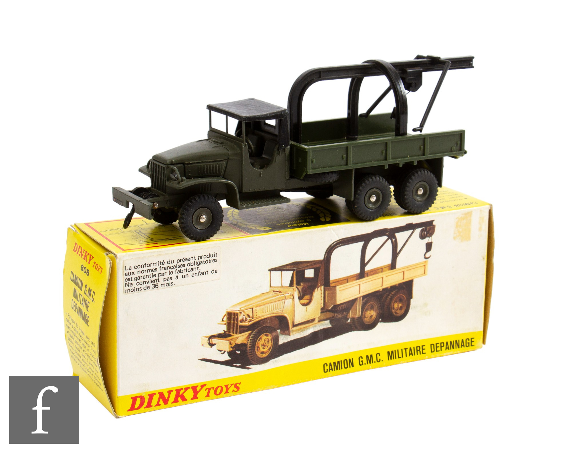 A French Dinky Military 808 GMC Crane Truck in drab green including concave hubs with black roof and