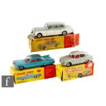 Three Dinky Toys diecast model cars, 145 Singer Vogue in silver with red interior, 147 Cadillac 62