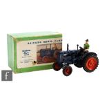 A Britains Farm Series 128F Fordson Major Tractor with dark blue body, orange wheels and black