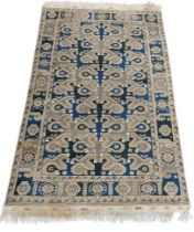 A semi-antique Middle Eastern blue and green ground geometric and diamond design Carpet, the large
