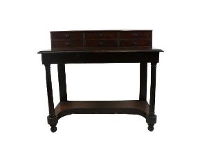 An Irish Victorian mahogany Writing Desk, in the manner of Strahan, the top with elevated back and