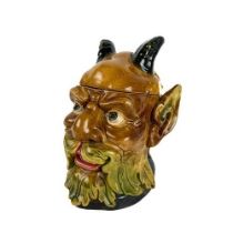 A rare Continental Majolica type Biscuit Barrel, modelled as a horned bearded figure, stamped with