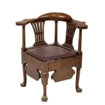 A George III walnut Corner Armchair, with shaped flat arm rests and above two pierced splats and