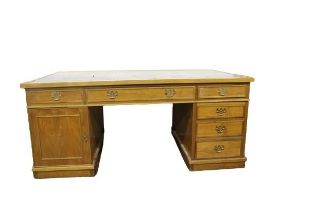 A Georgian style kneehole partners pedestal Desk, with tooled leather inset top, with frieze