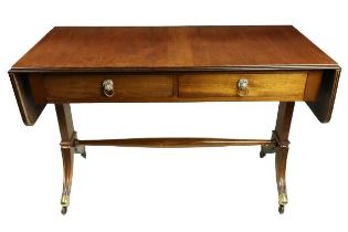A Regency style mahogany drop leaf Sofa Table, with two rectangular flaps flanking two frieze