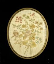 A good oval silk Needlework Picture, depicting floral sprays, framed, 25cms x 20cms (9 3/4" x 8");