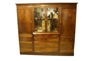 A fine quality Georgian period mahogany Wardrobe / Cabinet, the dentil moulded cornice above central