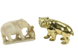 A heavy brass Figure, modelled as a bear; and an early 19th Century Middle Eastern alabaster
