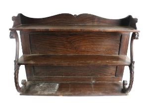 A William IV assimilated rosewood three tier Waterfall Table Bookcase, the shaped top over three