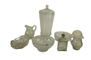 A canoe shaped cutglass Bowl, 28cms (11"), two cutglass Water Jugs, two similar, a cutglass Bowl,
