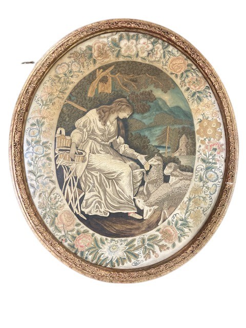 18th Century "Shepherdess with her Sheep," An oval silk work Picture within a floral border, 44cms