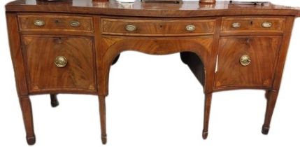 A Georgian period fine quality serpentine front mahogany Sideboard, the shaped top with central