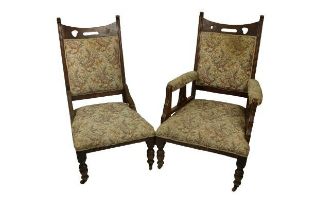 A pair of Edwardian Arts & Crafts style oak Ladies & Gents Parlour Armchairs, in the manner of C.F.