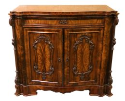 A fine quality Victorian figured mahogany serpentine shaped Drinks Cabinet, with moulded top over
