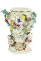 A 19th Century porcelain Meissen Vase, the floral encrusted design with cherubs and fruit, approx.