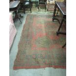 A 19th Century red ground Carpet, with multiple decorated border and centre, approx. 348cms x 282cms