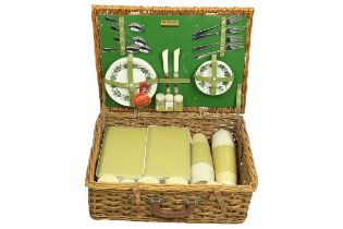 A Sirram Picnic Set, comprising flasks, containers, plates, cutlery etc., housed in a cane work